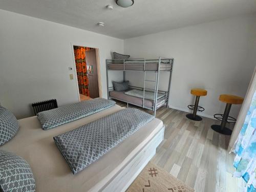 a room with two beds and a bunk bed at King Apartment Luftkurort Bayerischen Wald in Sankt Englmar