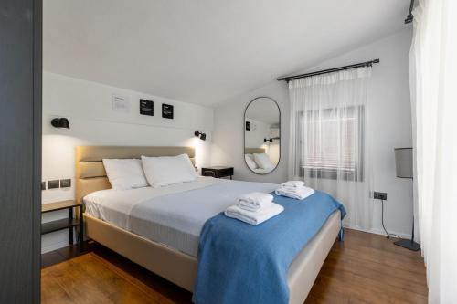 Giường trong phòng chung tại Allure Luxury Villas 2, Skiathos