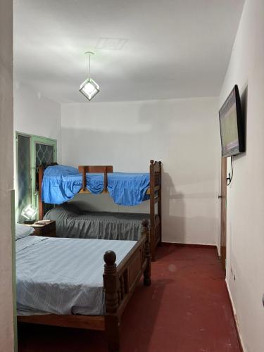a bedroom with two beds in a room at Nido Urbano in San Luis