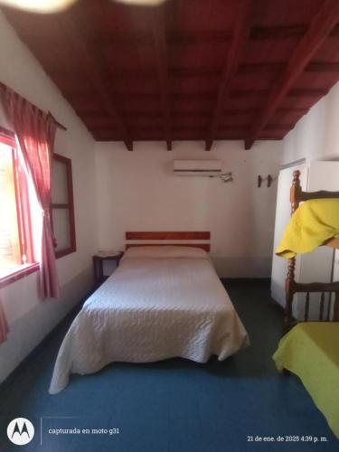 a bedroom with a large bed in a room at Hosteria sol naciente in Cafayate