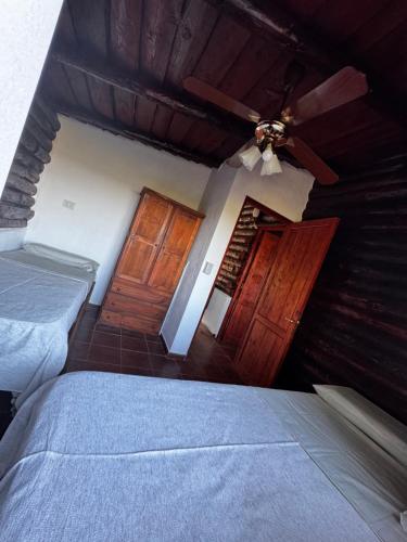 En eller flere senge i et værelse på Amanecerenunsueñoyacanto