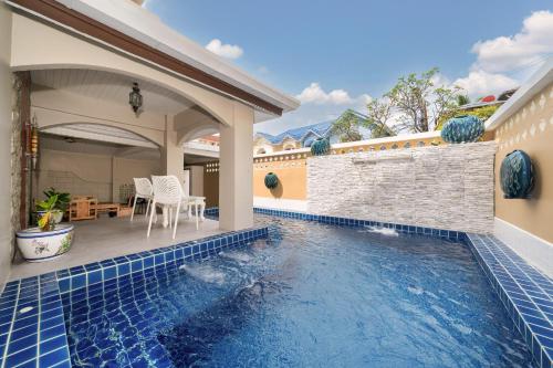 a swimming pool in the backyard of a house at Bangla Patong Pool Villas with 4 Villas different designs choose fro, photo before Book in Patong Beach