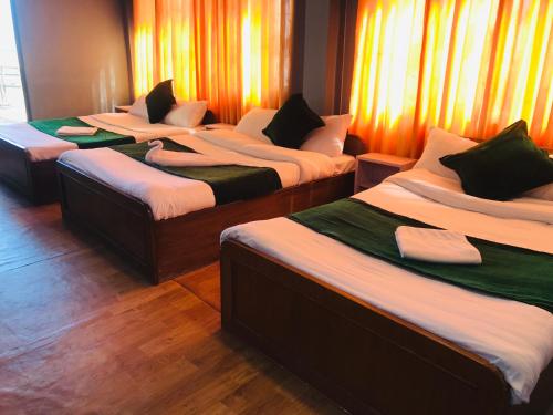 Letto o letti in una camera di Mita Hotel