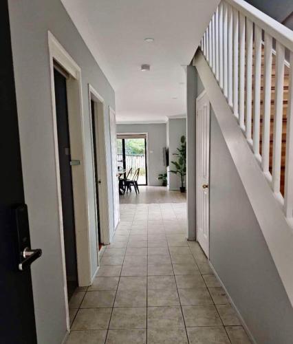 a hallway of a house with a staircase and a floor at Home away from home! in Liverpool