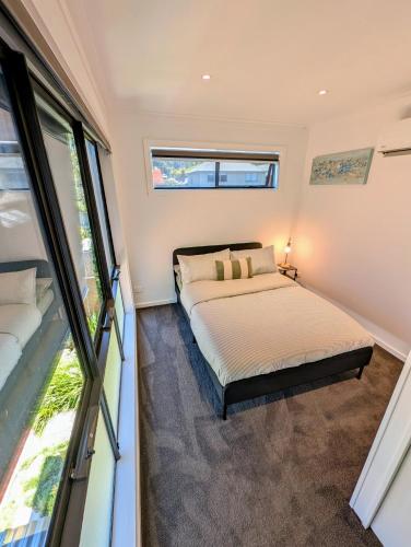 a bedroom with two beds and a window at Entire Studio in Moonee Ponds with Free Parking in Melbourne