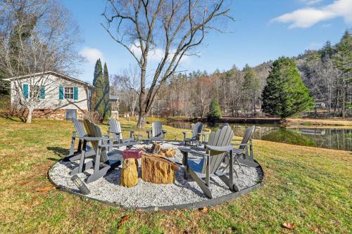 a group of chairs and a fire pit in the grass at Twin Ponds Retreats retreat in Whittier
