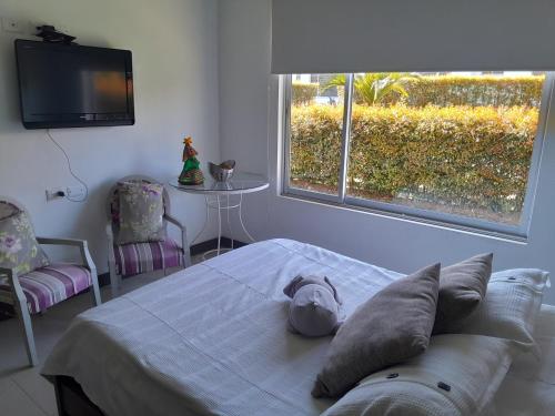 Giường trong phòng chung tại CASA CAMPESTRE COMPLETa