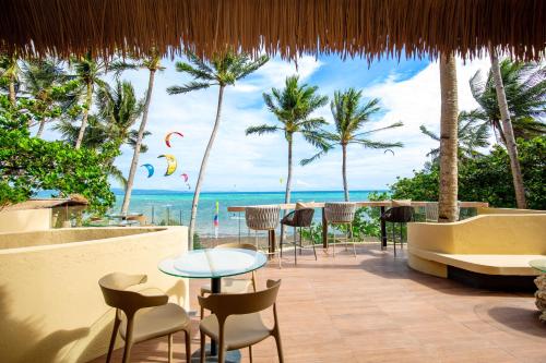 a restaurant with a view of the beach at Encantada Residences in Boracay