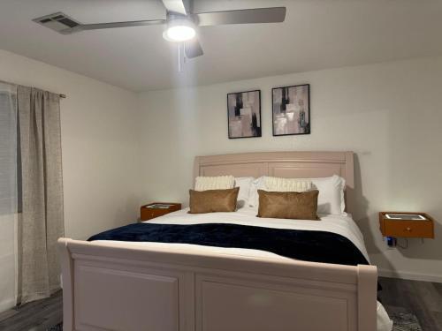a bedroom with a large white bed with two pillows at Casa Pueblo in Desert Hot Springs