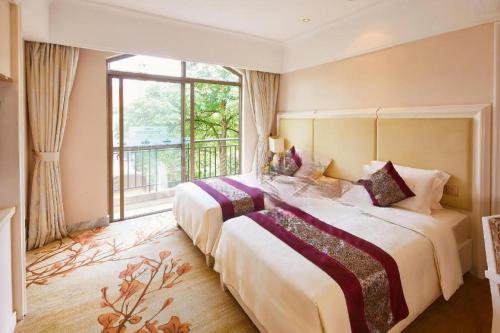 En eller flere senge i et værelse på Guangzhou Xiangjiang Health Valley