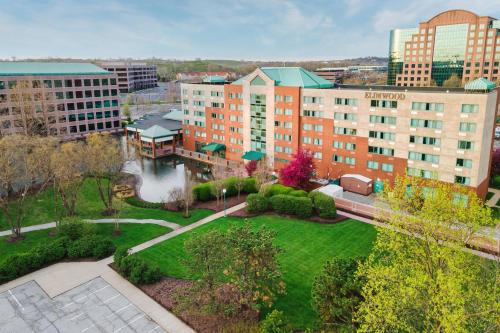 an aerial view of a park in a city at Elimwood Hotel, a Ramada by Wyndham in Maryland Heights