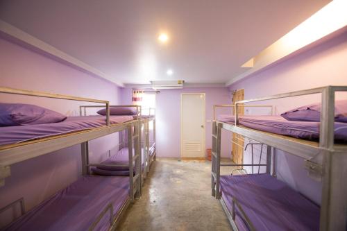 Кровать или кровати в номере Dozy Lamoon House
