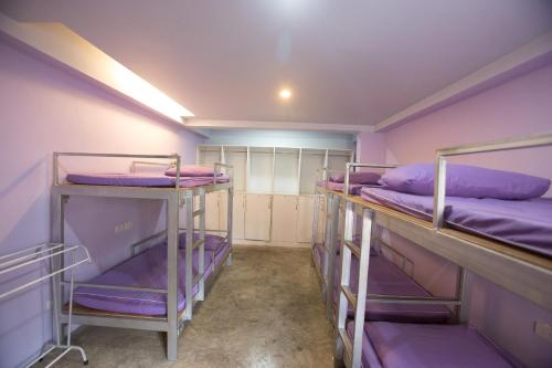 Ένα ή περισσότερα κρεβάτια σε δωμάτιο στο Dozy Lamoon House