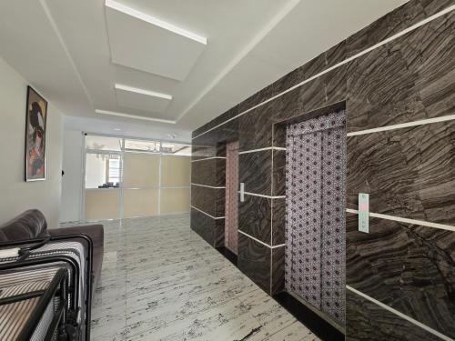 a bathroom with a shower in a room at Hotel Space Comfort Inn in Karmād