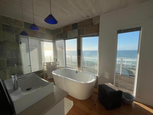 a large bathroom with a tub and a sink at 8 Muller st Tergniet in Tergniet