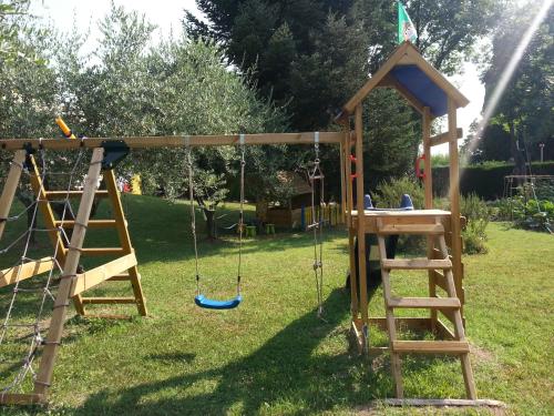 a playground with a ladder and a swing at Al Villino del Sole in Fano