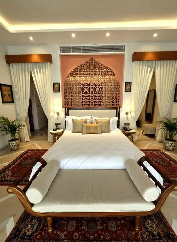 a large bedroom with a large bed in a room at Sukoon Gah in Bedla