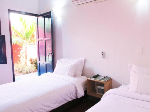 Postel nebo postele na pokoji v ubytování Zana Hotel Boutique