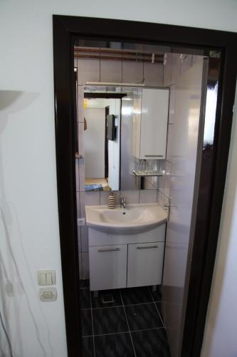 a bathroom with a sink and a mirror at Holiday Home Mađerka in Štrigova