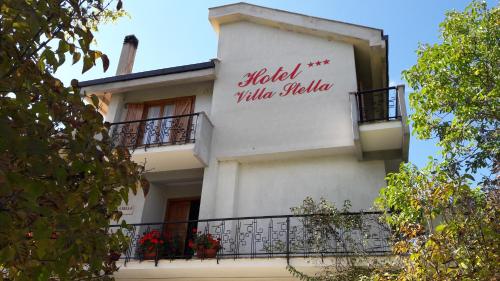 a building with a sign that reads rabilla villaella at Hotel Villa Stella in Cascia