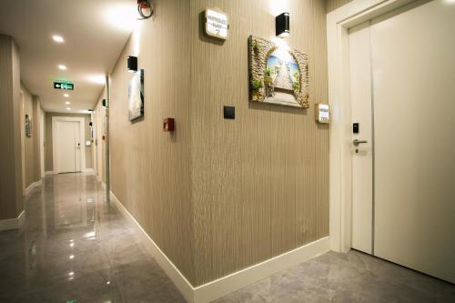a hallway in a building with a hallway at Hotel Iz in Izmir
