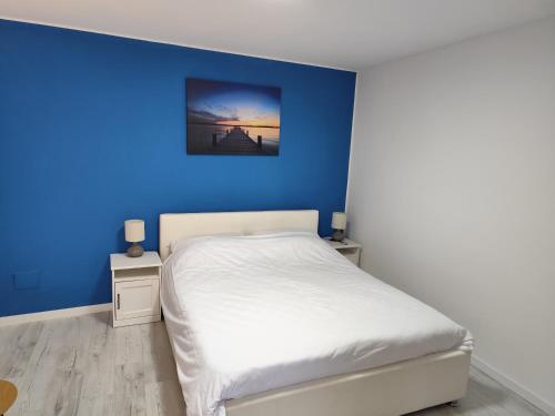 En eller flere senge i et værelse på Guest House Valentino