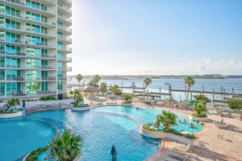 an image of a swimming pool at a resort at Caribe D412 in Orange Beach