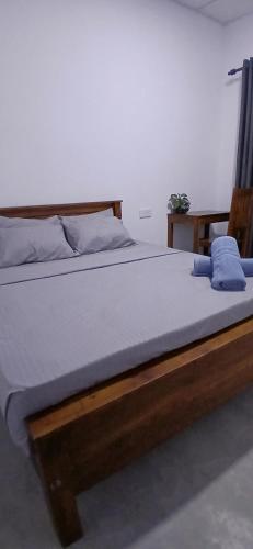 En eller flere senge i et værelse på Wanguwa Lodge & Restaurant