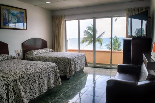 Voodi või voodid majutusasutuse Hotel Real del Mar toas