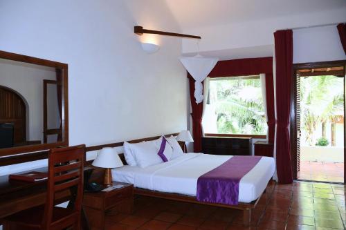 En eller flere senge i et værelse på Victoria Phan Thiet Beach Resort & Spa