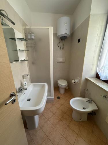 a bathroom with a sink and a toilet at Casa Vacanze Cesarina - Catanzaro centro in Catanzaro