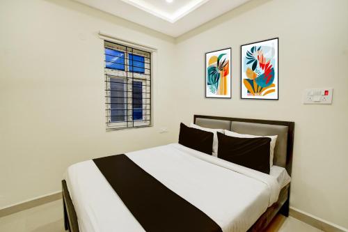 En eller flere senge i et værelse på Hotel O RS HOTELS