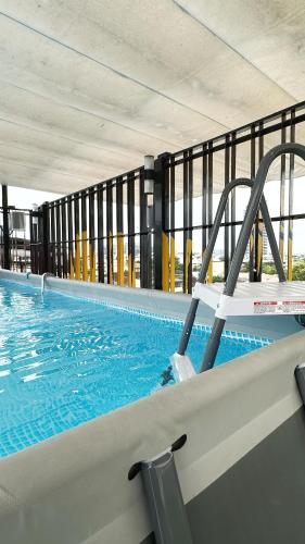 a large swimming pool with at Jam Hostel Bangkok in Bangkok