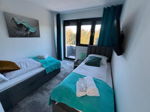 En eller flere senge i et værelse på Apartament LuMi