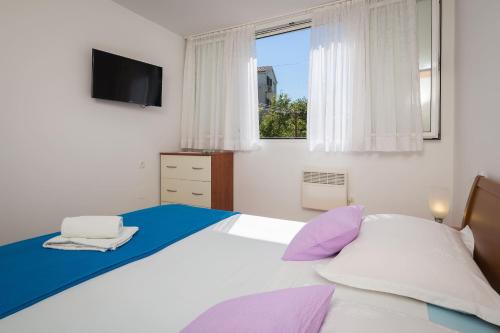 Postel nebo postele na pokoji v ubytování Apartment Mirjana