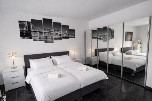 Postel nebo postele na pokoji v ubytování Exklusive Moderne Wohnung Gießen Stadtnähe mit Balkon