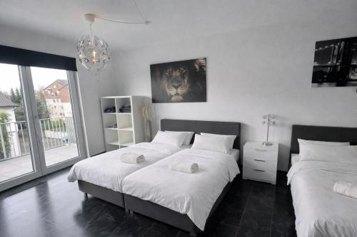 Postel nebo postele na pokoji v ubytování Exklusive Moderne Wohnung Gießen Stadtnähe mit Balkon