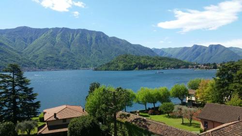 a view of a lake with mountains in the background at Hotel Lario in Mezzegra