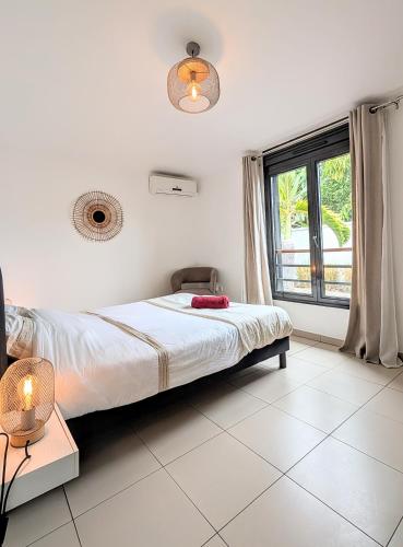 En eller flere senge i et værelse på Etang Salé les bains - Corail Cosy