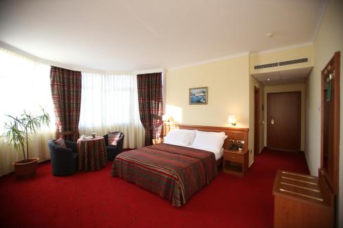Postel nebo postele na pokoji v ubytování Hotel Continental