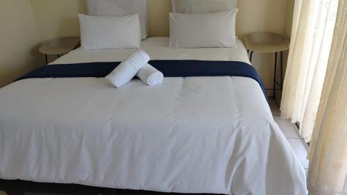 Giường trong phòng chung tại Shelly Beach Guest House