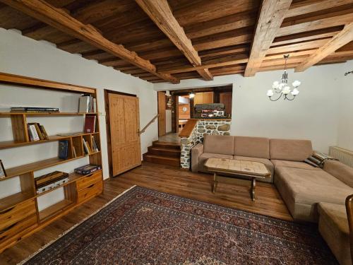 a living room with a couch and a table at Bergbauer Offenburg in Pöls