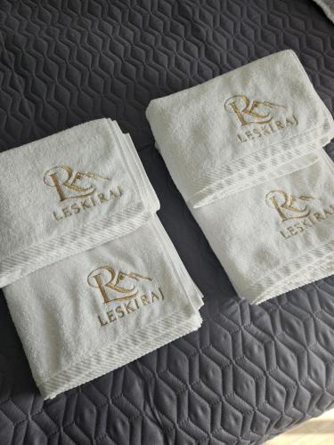a bed with two napkins on top of it at Leski Raj in Lesko