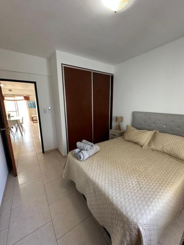 a bedroom with a bed and a door to a patio at Dpto 9 - Colon - 1 DORMITORIO - PQ ALQUILERES TEMPORARIOS in Colón