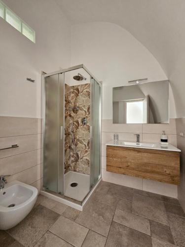 a bathroom with a shower and a sink at Residence Limoneto Ischia in Ischia