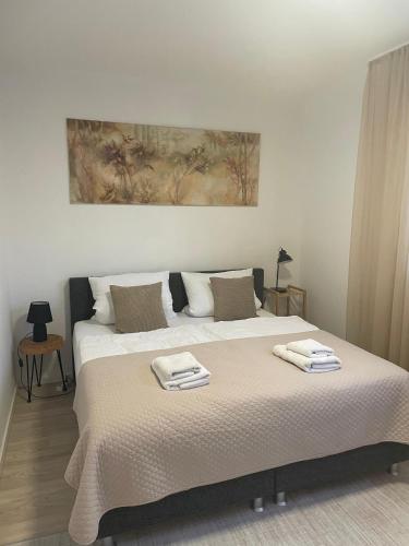 a bedroom with a bed with two towels on it at Apartment with a great location in Weilheim in Weilheim in Oberbayern