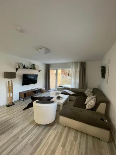 a living room with a couch and a table at Apartment with a great location in Weilheim in Weilheim in Oberbayern