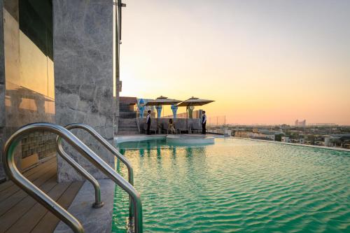 a swimming pool on the roof of a building at Maritztel Bangkok Hotel in Ban Bang Toei (1)