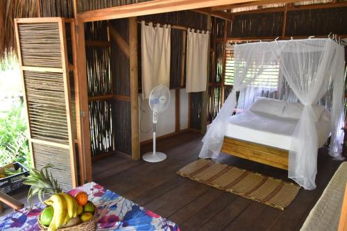 Ein Bett oder Betten in einem Zimmer der Unterkunft Playa Pikua Ecolodge