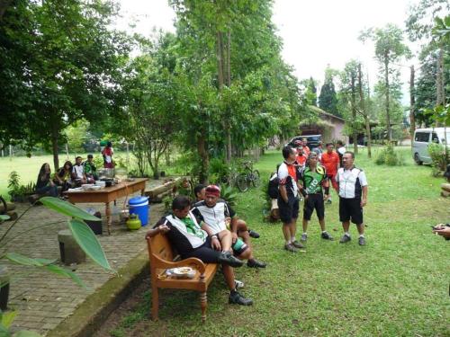 a group of people standing around in a yard at Ronia Mountain Villa Lembang in Lembang